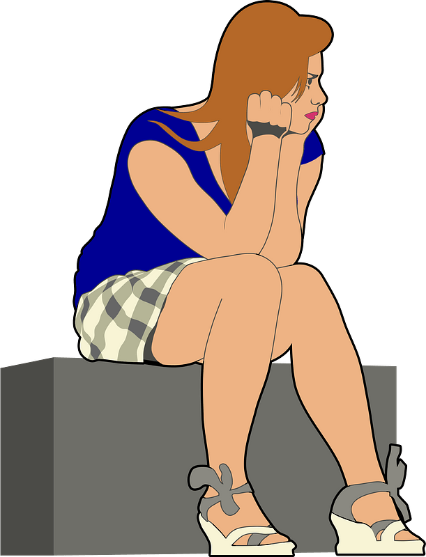 Young woman sitting on stone in bright colors