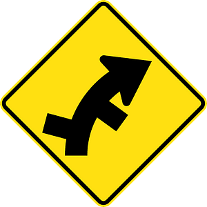 (W2-11) Staggered side road intersection, first from left on a curve on right