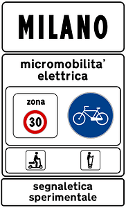 Town sign: start of urban area where electric micromobility is being experimented