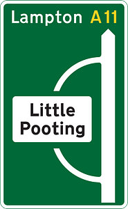 Junction ahead of a primary route with a non-primary route through a town or village that has been by-passed