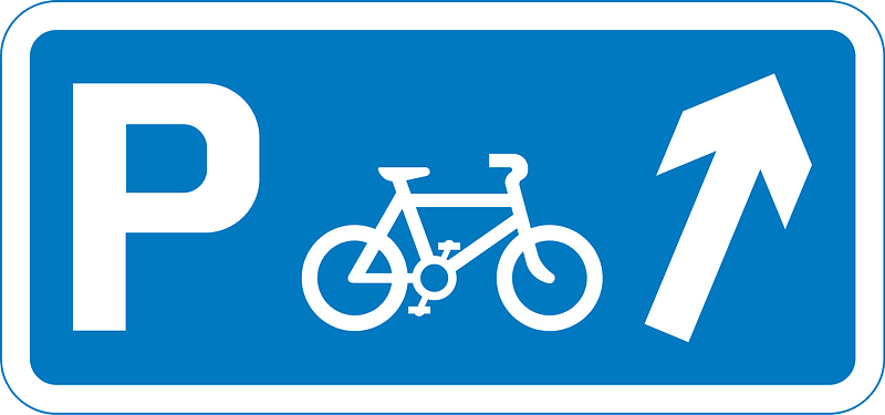 Junction ahead leading to a parking place for pedal cycles