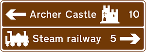 Junction ahead from a motorway exit slip road to the tourist attractions shown