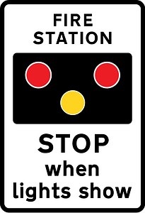 Fire station ahead, STOP when lights show. "FIRE" may be varied to "AMBULANCE"