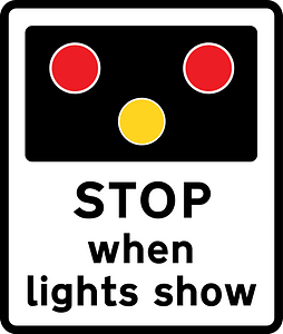 Warning of light signals at a level crossing ahead (the sign may also be used at a lifting bridge or airfield)