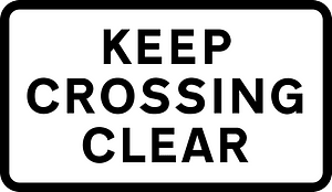 Supplementary plate warning drivers to not block the level crossing