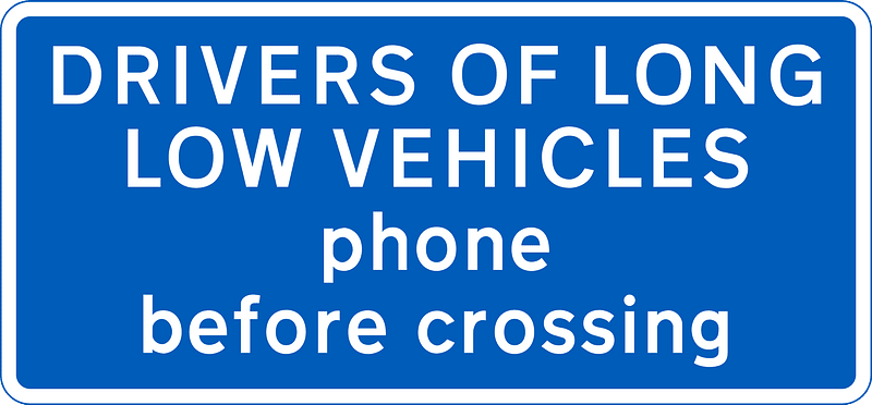 Information sign for large vehicles informing to phone at automatic level crossing