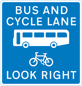 Contra-flow bus lane which pedal cycles may also use with traffic approaching from the right (reminder for pedestrians)