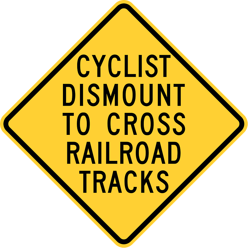 Cyclists Dismount To Cross Railroad Tracks, Hemet, California
