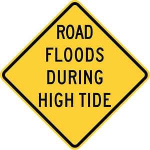 Road floods during high tide, Hawaii
