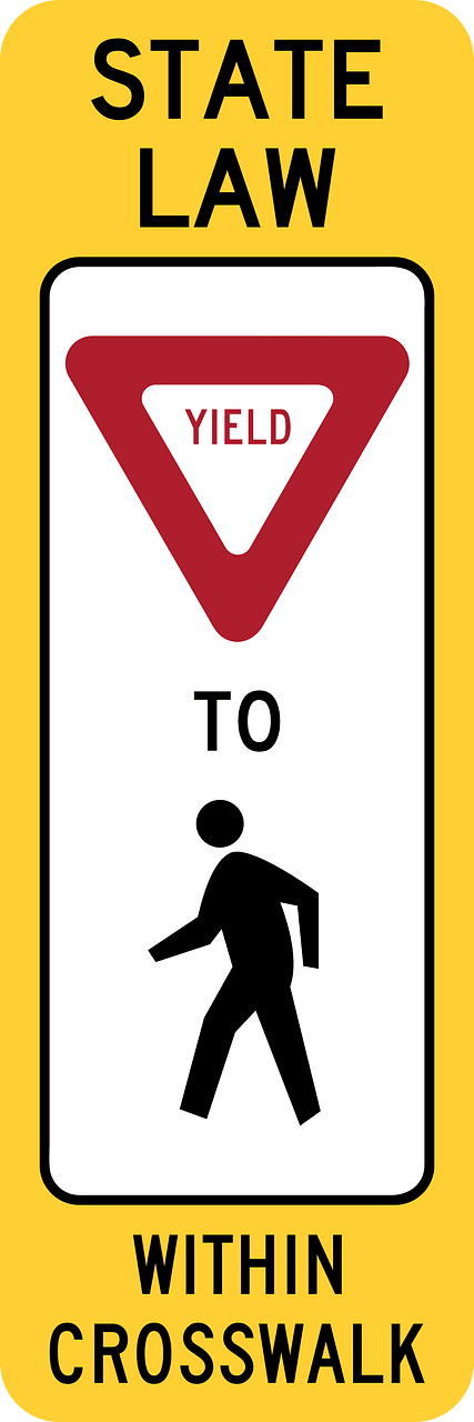 R1-6: In-Street Ped Crossing (The legend STATE LAW is optional. A fluorescent yellow-green color may be used instead of yellow for this sign.)