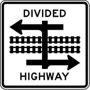 Divided highway transit rail crossing