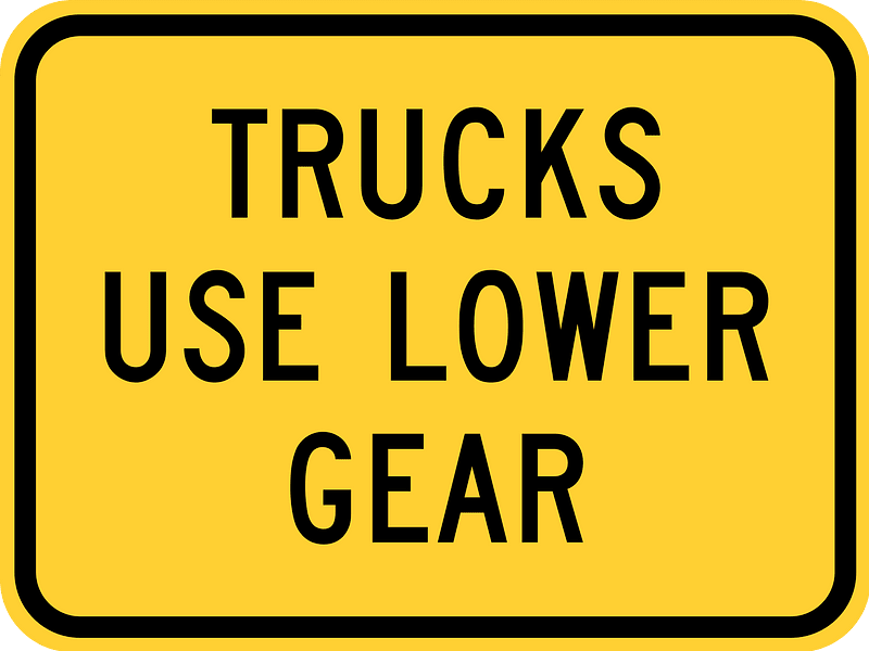 Trucks use lower gear (plaque)