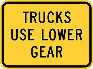 Trucks use lower gear (plaque)