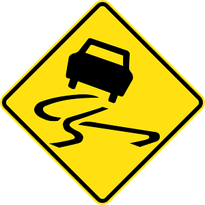 Slippery road surface sign in Australia