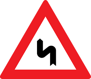 Double bend ahead sign in Austria