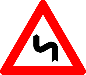 Double bend ahead sign in Belgium