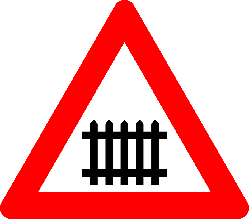 Level crossing with barriers ahead sign in Belgium