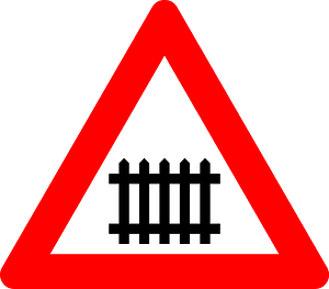 Level crossing with barriers ahead sign in Belgium