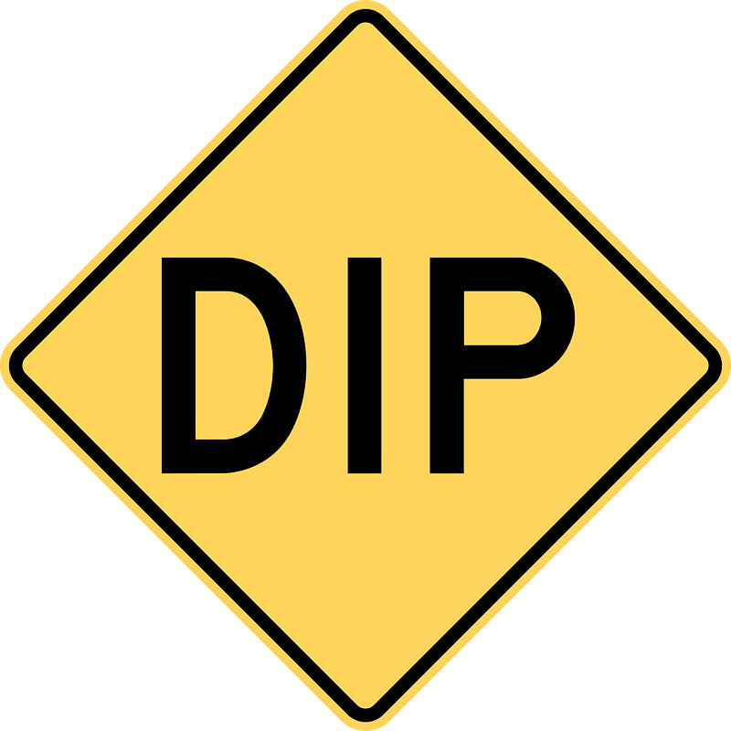 Dip in road sign in British Columbia