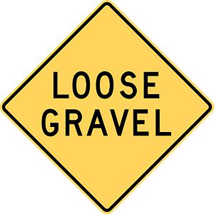 Loose road surface sign in British Columbia