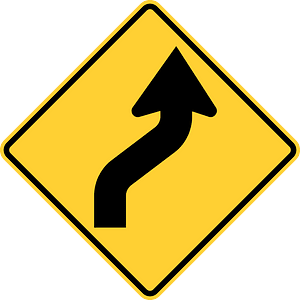 Double sharp curve ahead sign in Canada