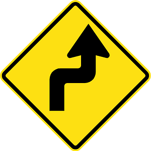 Double sharp curve ahead sign in Chile