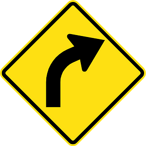 Gentle curve ahead sign in Chile