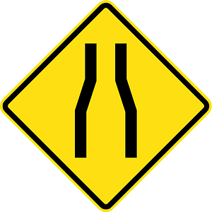 Road narrows ahead sign in Chile