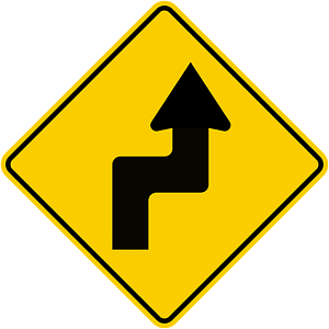Double sharp curve ahead sign in Colombia