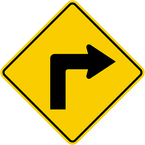 Sharp curve ahead sign in Colombia