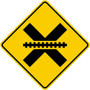 Uncontrolled railroad crossing ahead sign in Colombia