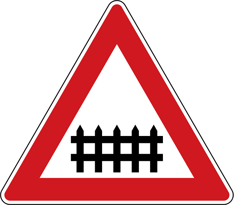 Level crossing with barriers ahead sign in Czech Republic