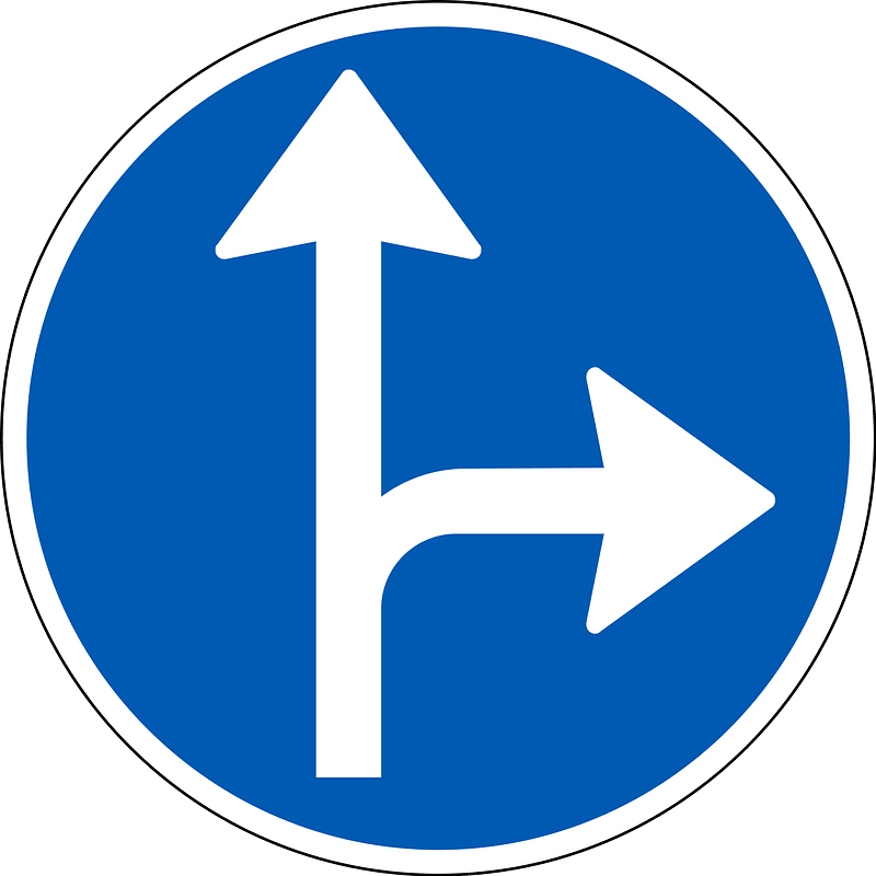 Proceed straight or turn right only sign in Denmark