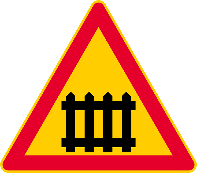 Level crossing with barriers ahead sign in Finland