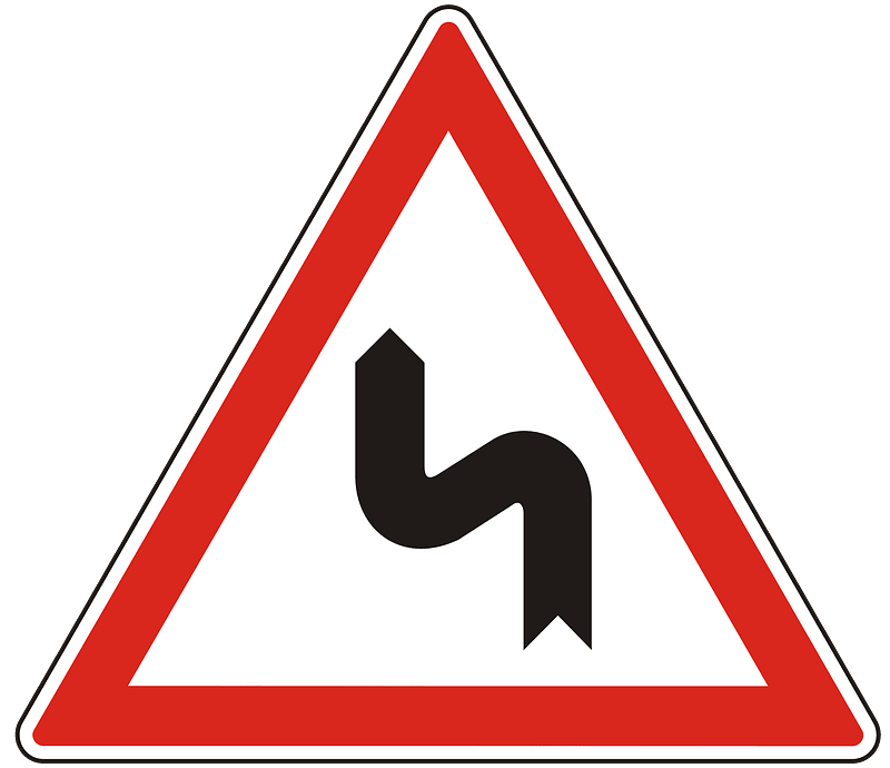 Double bend ahead sign in Hungary