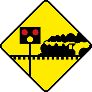 Level crossing with barriers ahead sign in Ireland