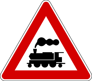 Level crossing without barriers ahead sign in Italy