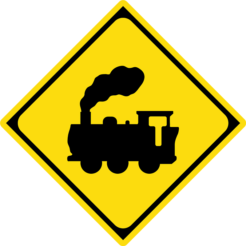 Level railroad crossing with barriers ahead sign in Japan