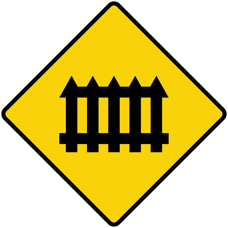 Level railroad crossing with barriers ahead sign in Liberia