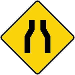 Road narrows ahead sign in Liberia