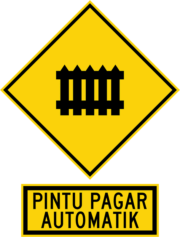 Level railroad crossing with barriers ahead sign in Malaysia