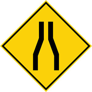 Road narrows ahead sign in Malaysia