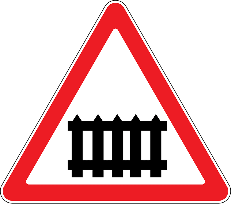 Level crossing with barriers ahead sign in Moldova