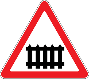 Level crossing with barriers ahead sign in Moldova