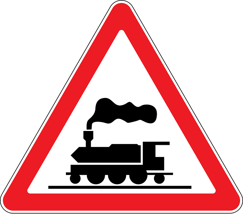 Level crossing without barriers ahead sign in Moldova