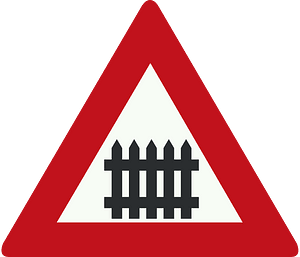 Level crossing with barriers ahead sign in Netherlands