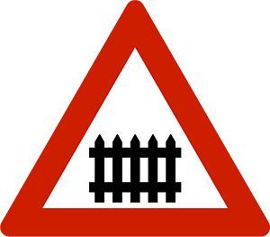 Level crossing with barriers ahead sign in Norway