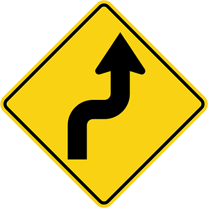 Double sharp curve ahead sign in Ontario