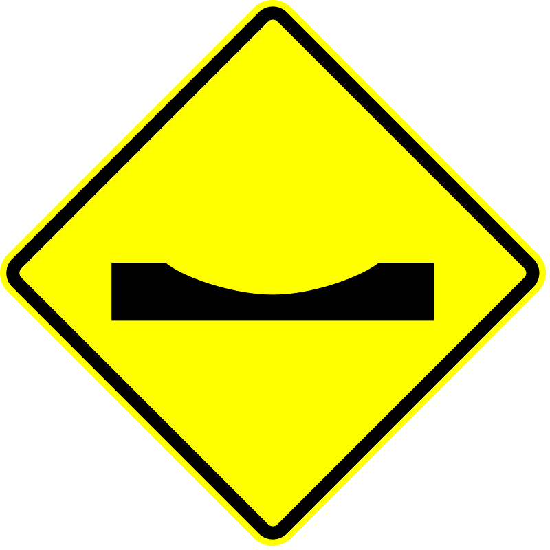 Dip in road sign in Panama