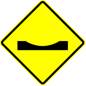 Dip in road sign in Panama